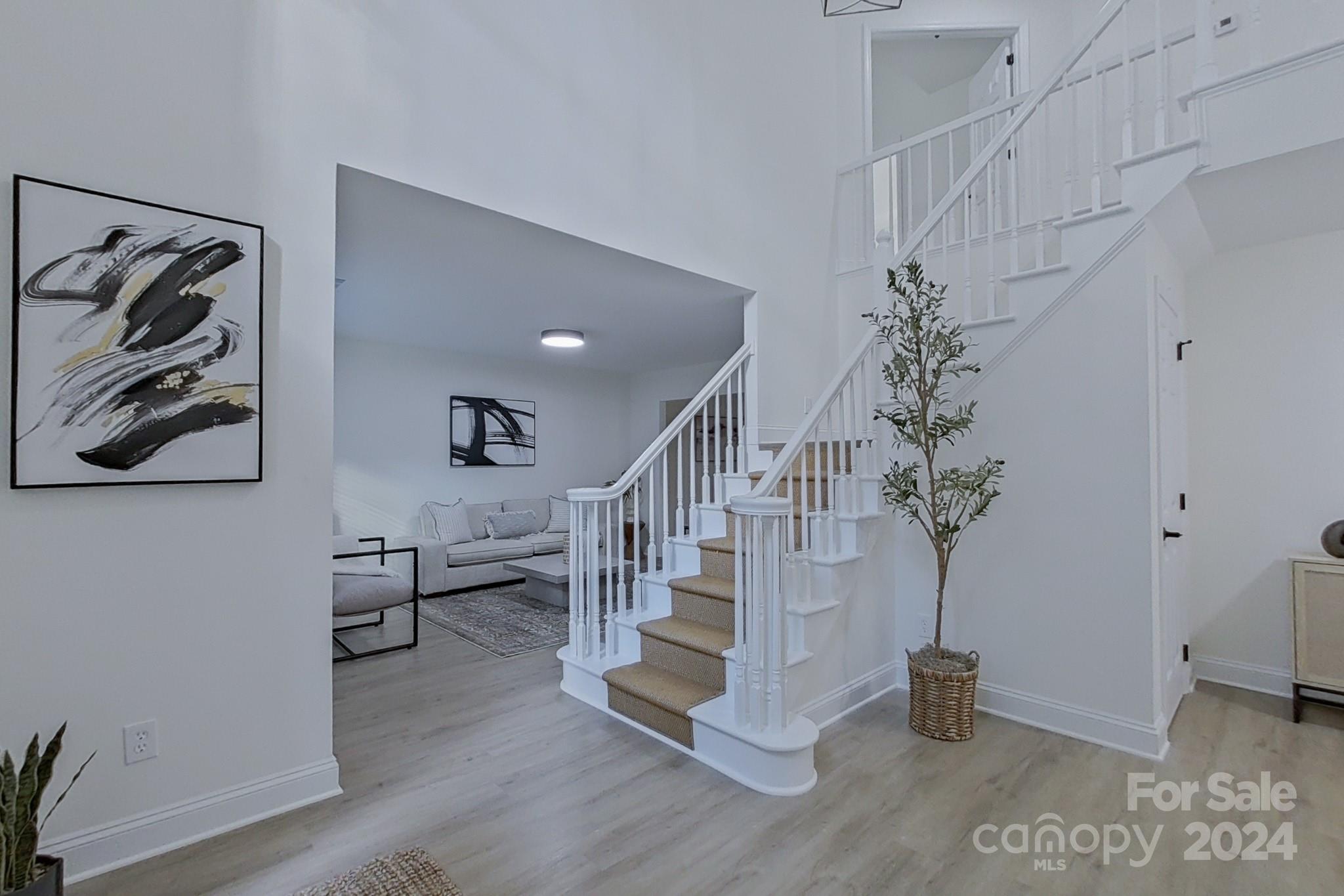 5710 Stream Ridge Drive Charlotte, NC 28269 - Photo 9 of 48 a view of entryway with livingroom and wooden floor