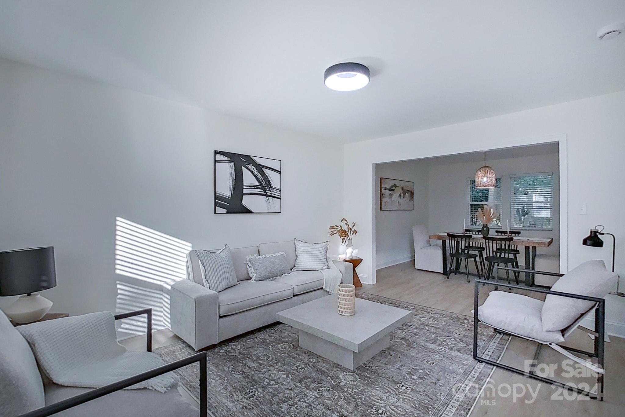 5710 Stream Ridge Drive Charlotte, NC 28269 - Photo 10 of 48 a living room with furniture and wooden floor