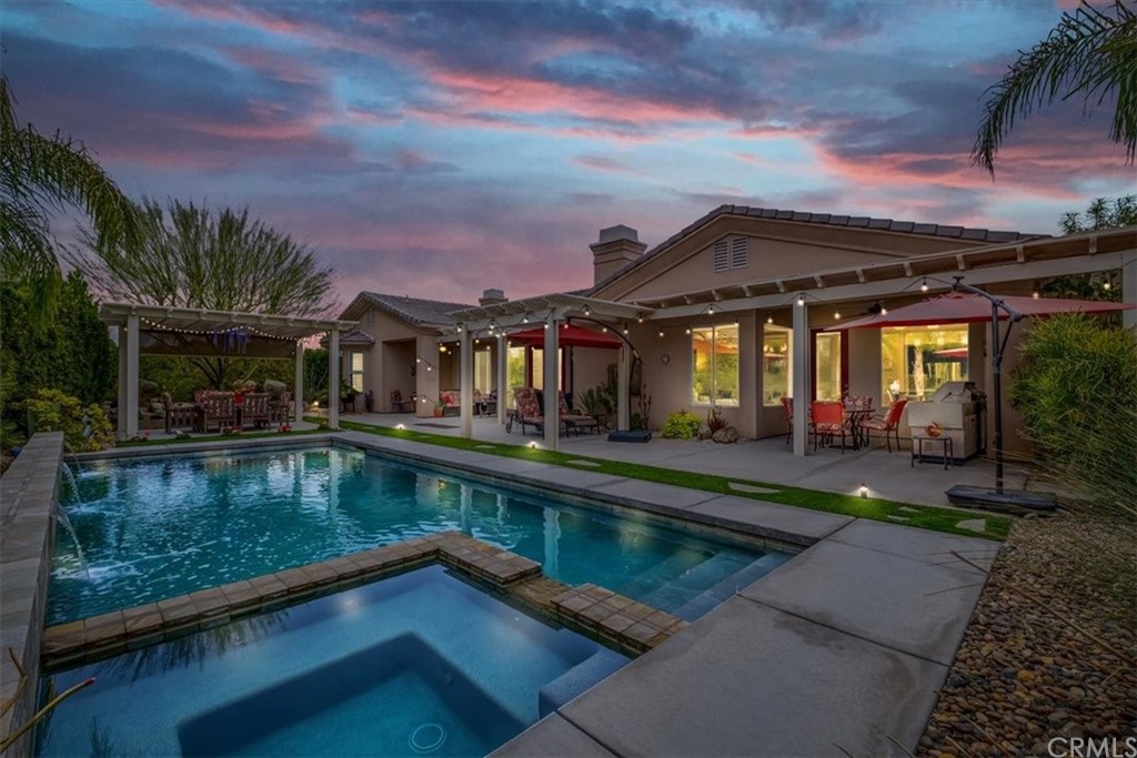 15 Napoleon Road Rancho Mirage, CA 92270 - Photo 1 of 1 a view of a house with swimming pool and sitting area