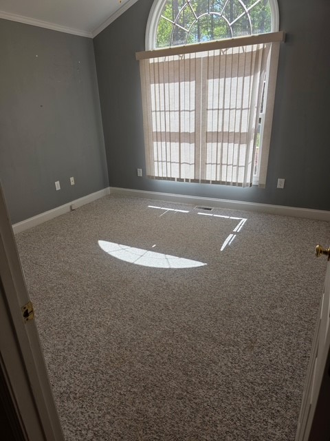 905 North Crestview Drive Seneca, SC 29678 - Photo 15 of 16 This spacious room features a large arched window, offering abundant natural light and serene views.