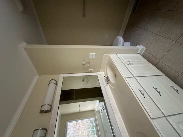 905 North Crestview Drive Seneca, SC 29678 - Photo 8 of 16 This bright bathroom features a single vanity, a toilet, and tiled flooring.