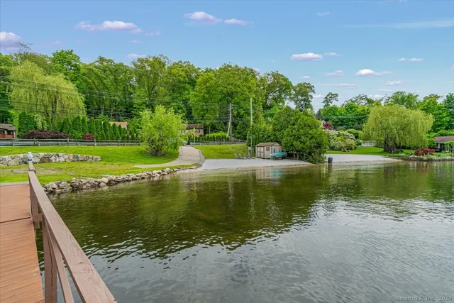 a view of a lake with a yard