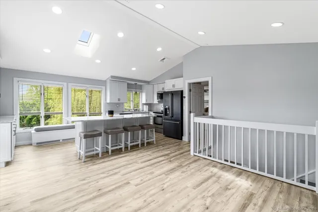 a kitchen with a table and chairs