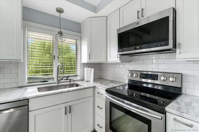 a kitchen with a stove and a microwave