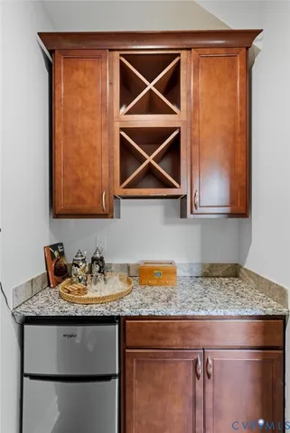 a kitchen with a sink a microwave and cabinets