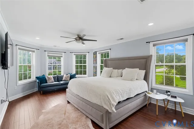 a bedroom with a bed and a couch