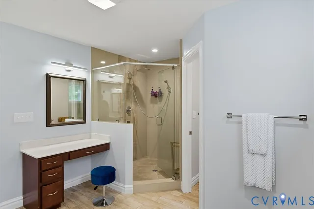 a bathroom with a shower sink and mirror