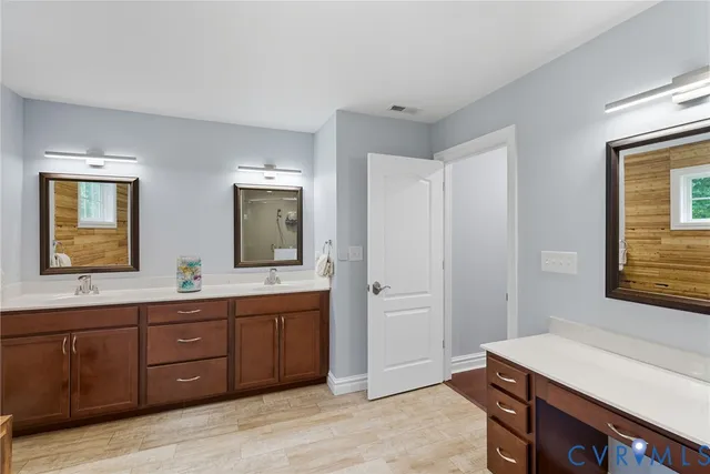 a view of room with sink and mirror