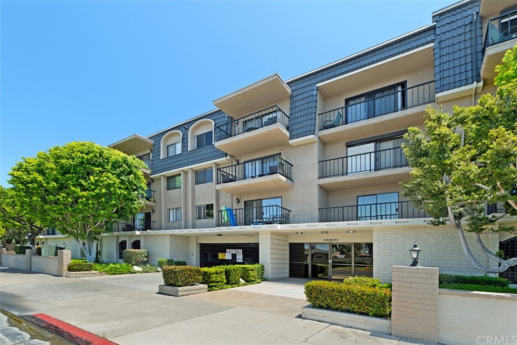 12400 Montecito Road, Unit 308 Seal Beach, CA 90740 - Photo 1 of 1 a front view of a building with street