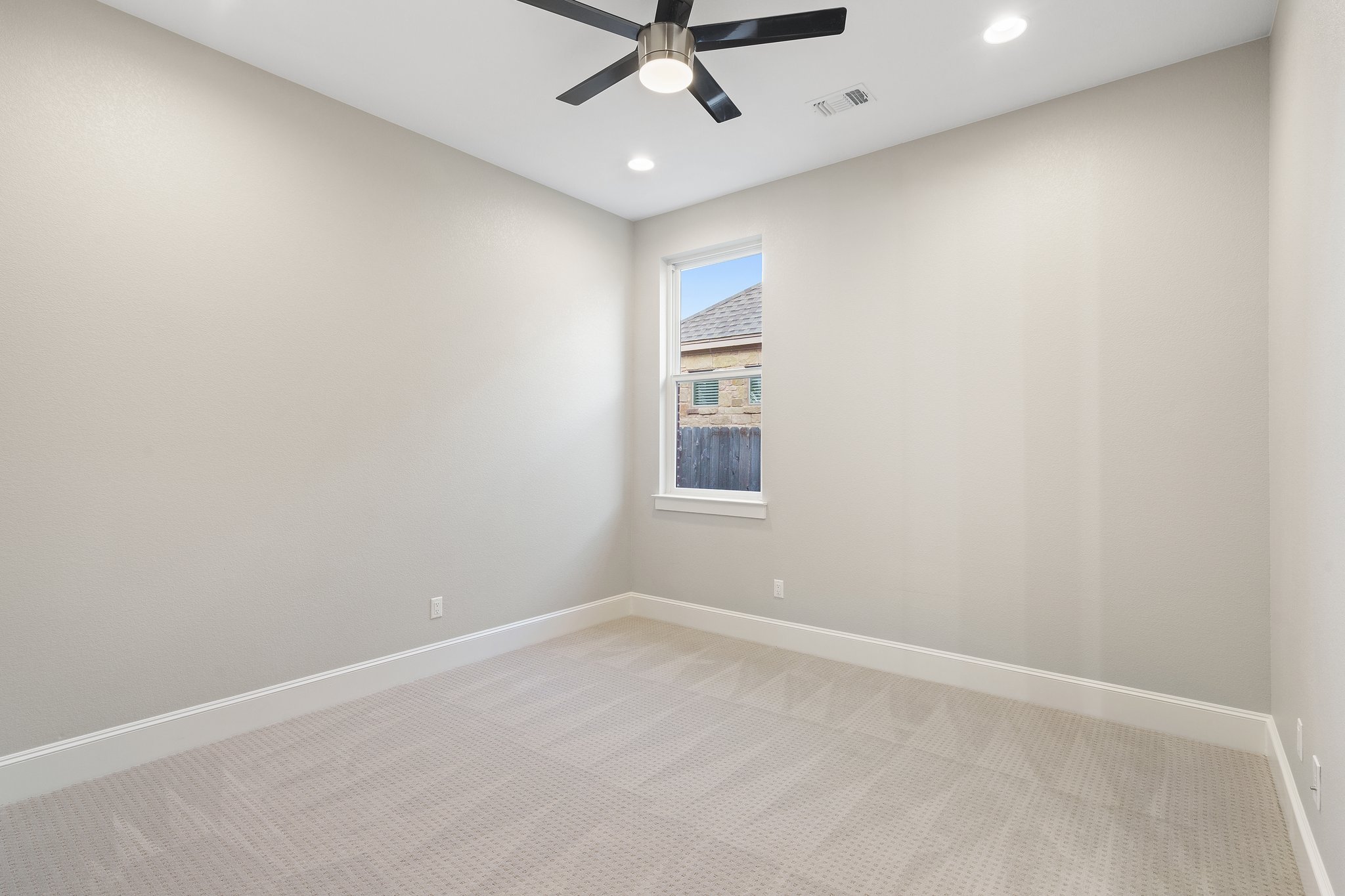 112 Axis Loop Georgetown, TX 78628 - Photo 29 of 39 an empty room with a ceiling fan and window