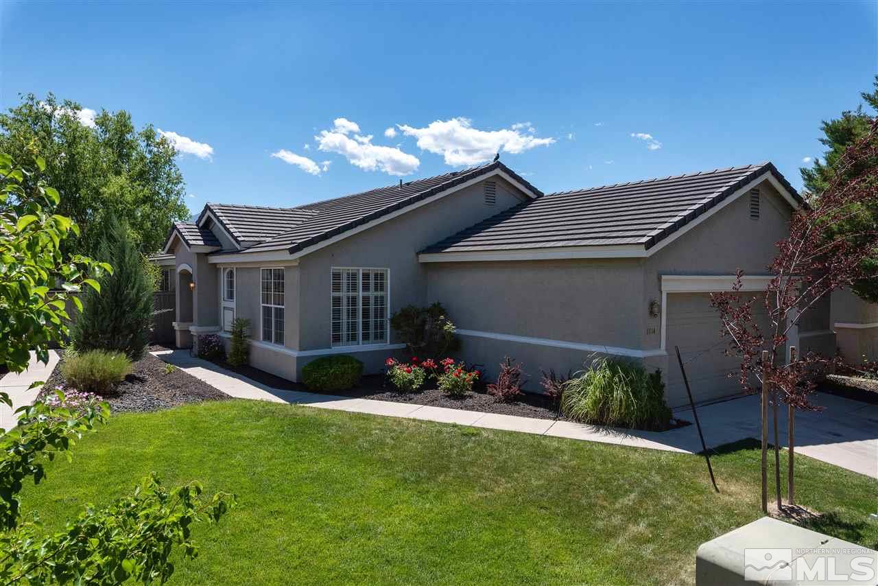 1614 Mountain Lane Reno, NV 89521 - Photo 22 of 25 a view of a house with a yard potted plants and a patio