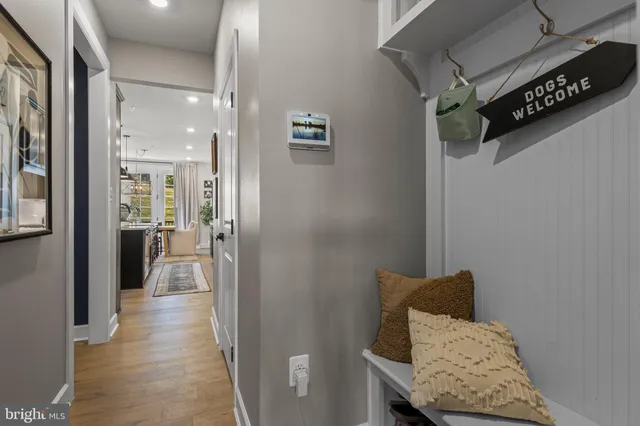a view of hallway with wooden floor