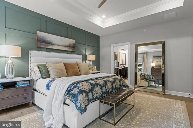 a bedroom with a bed and a mirror