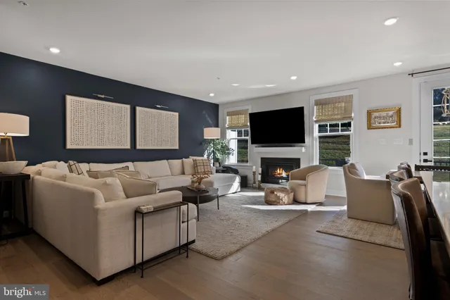 a living room with fireplace furniture and a flat screen tv
