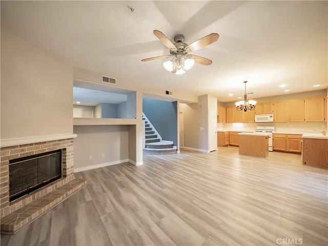 a view of a kitchen with a stove cabinets and wooden floor