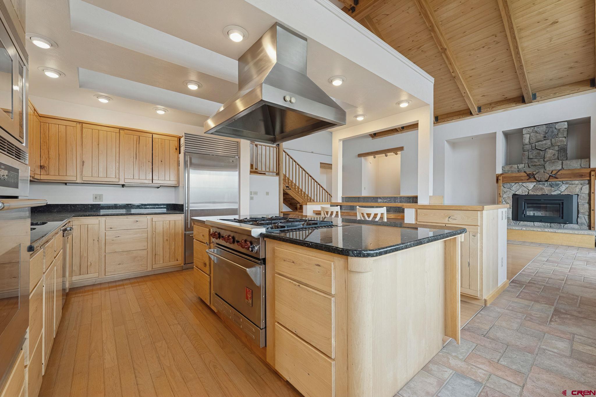 481 Far View Road Durango, CO 81303 - Photo 9 of 45 a kitchen with granite countertop a sink and cabinets