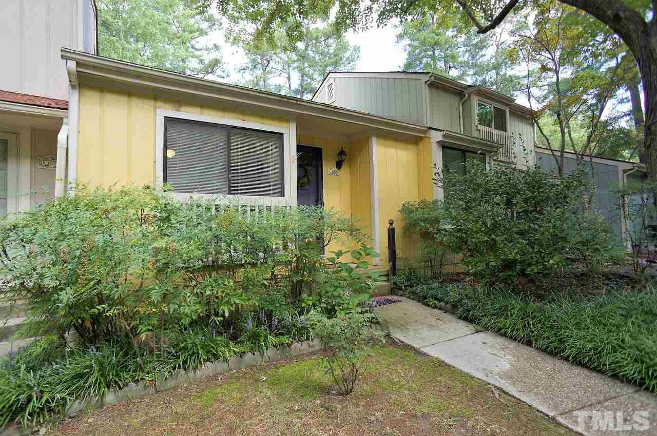 5803 Mapleridge Road Raleigh, NC 27609 - Photo 1 of 23 a view of a house with potted plants and a large tree