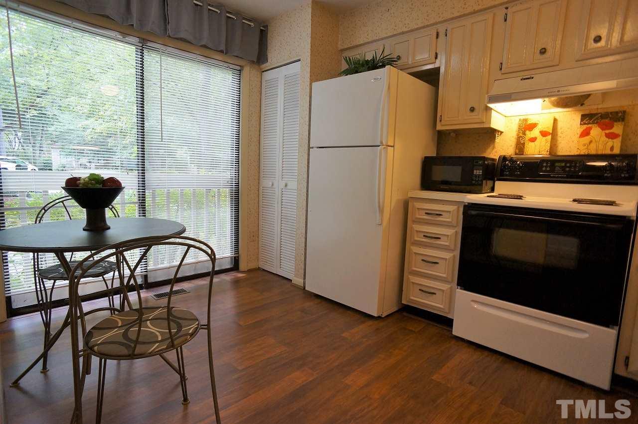 5803 Mapleridge Road Raleigh, NC 27609 - Photo 2 of 23 a kitchen with appliances and a window