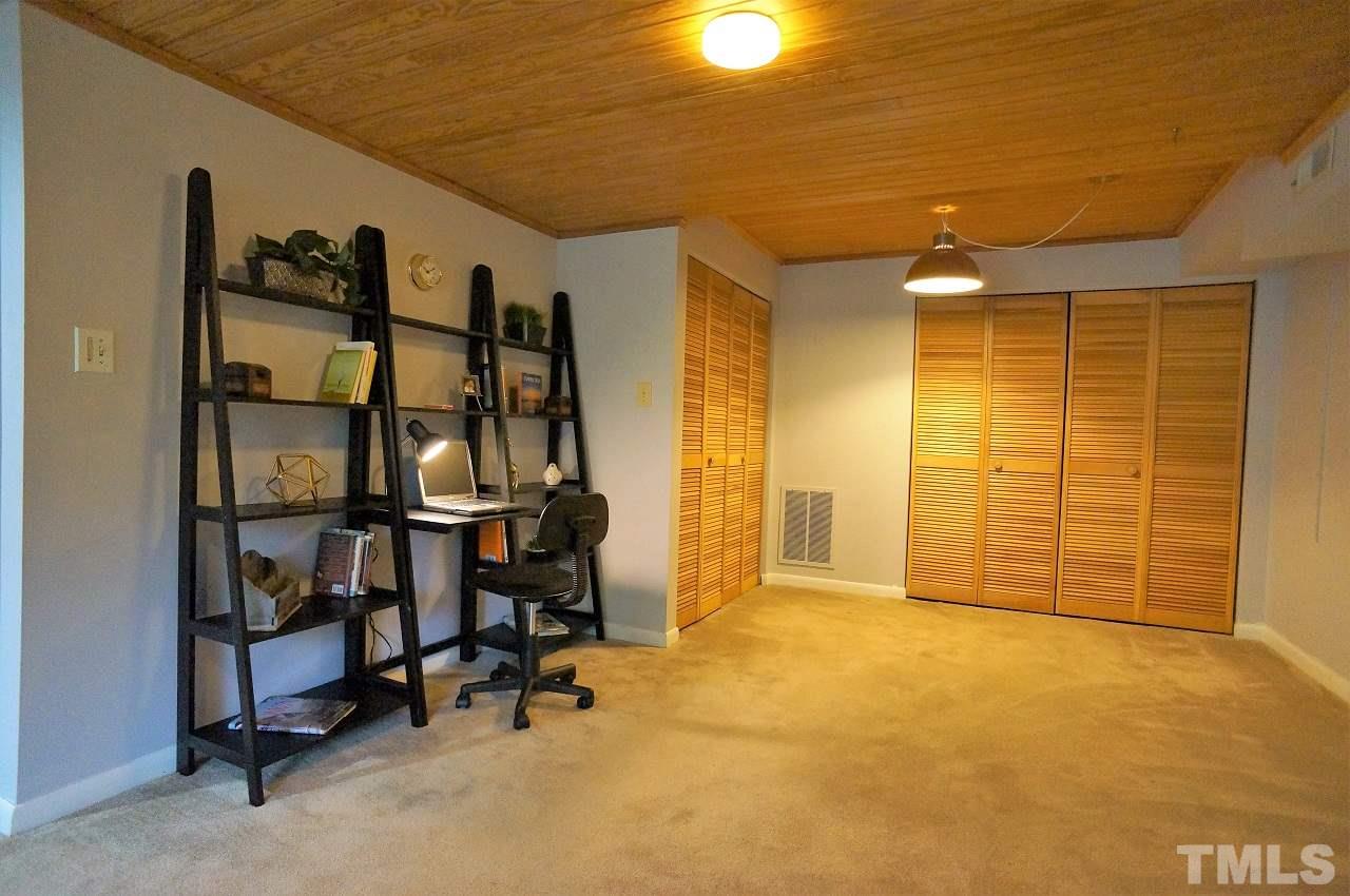 5803 Mapleridge Road Raleigh, NC 27609 - Photo 14 of 23 a view of a room with gym equipment