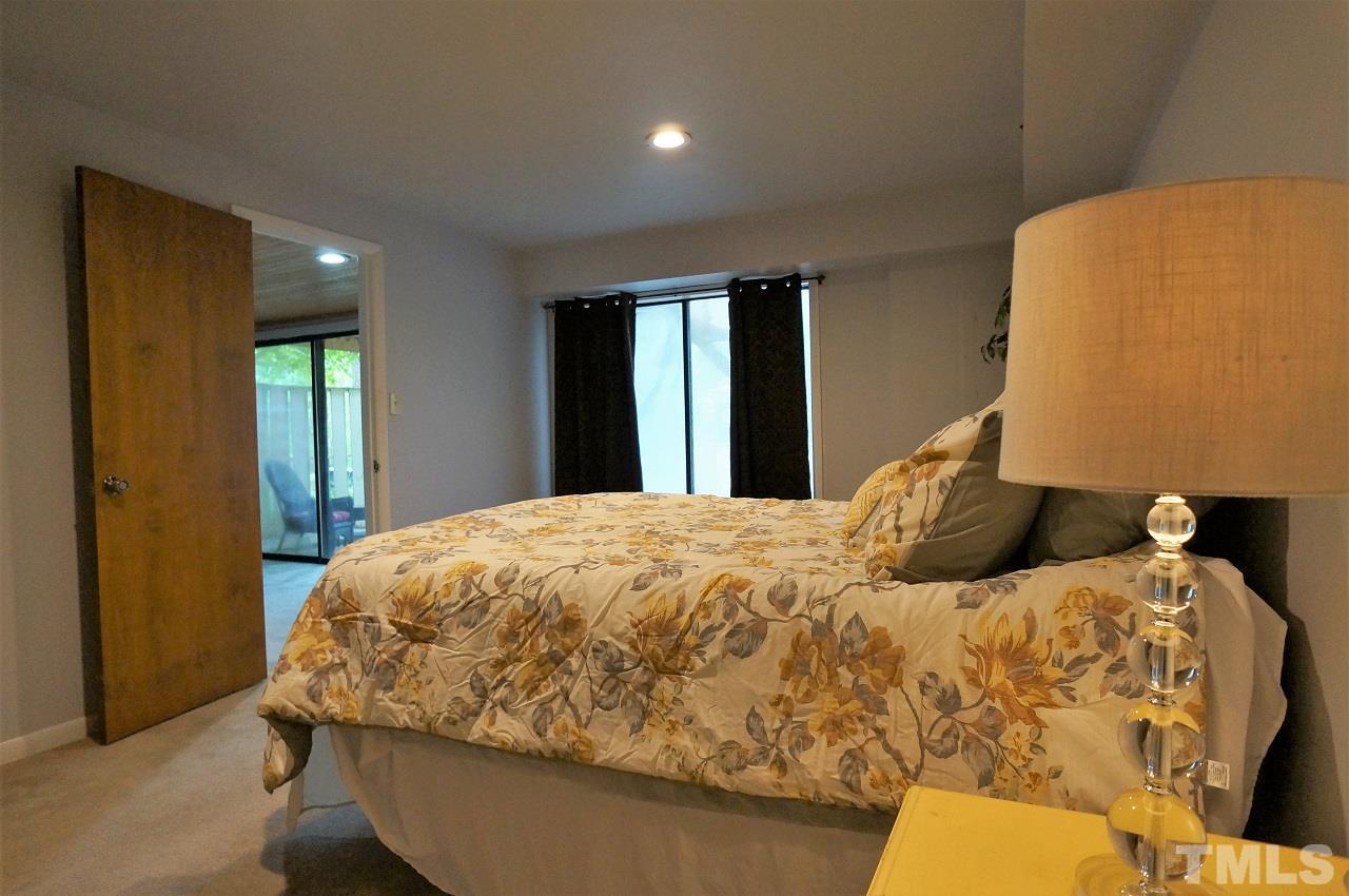 5803 Mapleridge Road Raleigh, NC 27609 - Photo 18 of 23 a bedroom with a bed and window