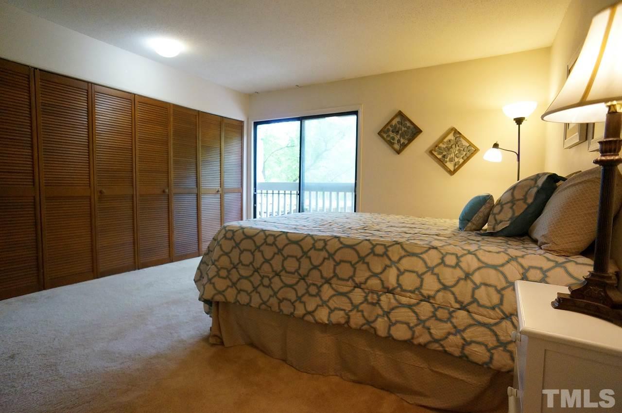 5803 Mapleridge Road Raleigh, NC 27609 - Photo 10 of 23 a bedroom with a bed and a window
