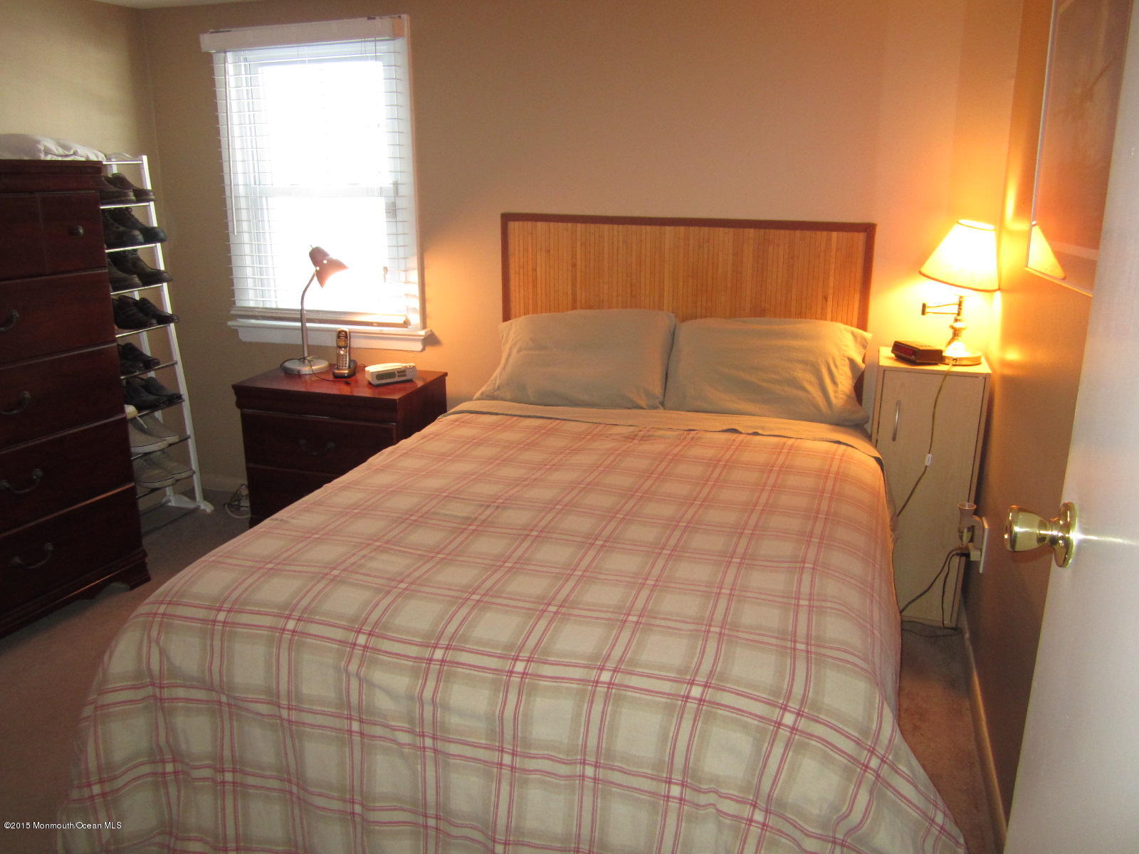 115 10th Avenue Spring Lake Heights, NJ 07762 - Photo 7 of 15 a large bed sitting in a bedroom next to a window
