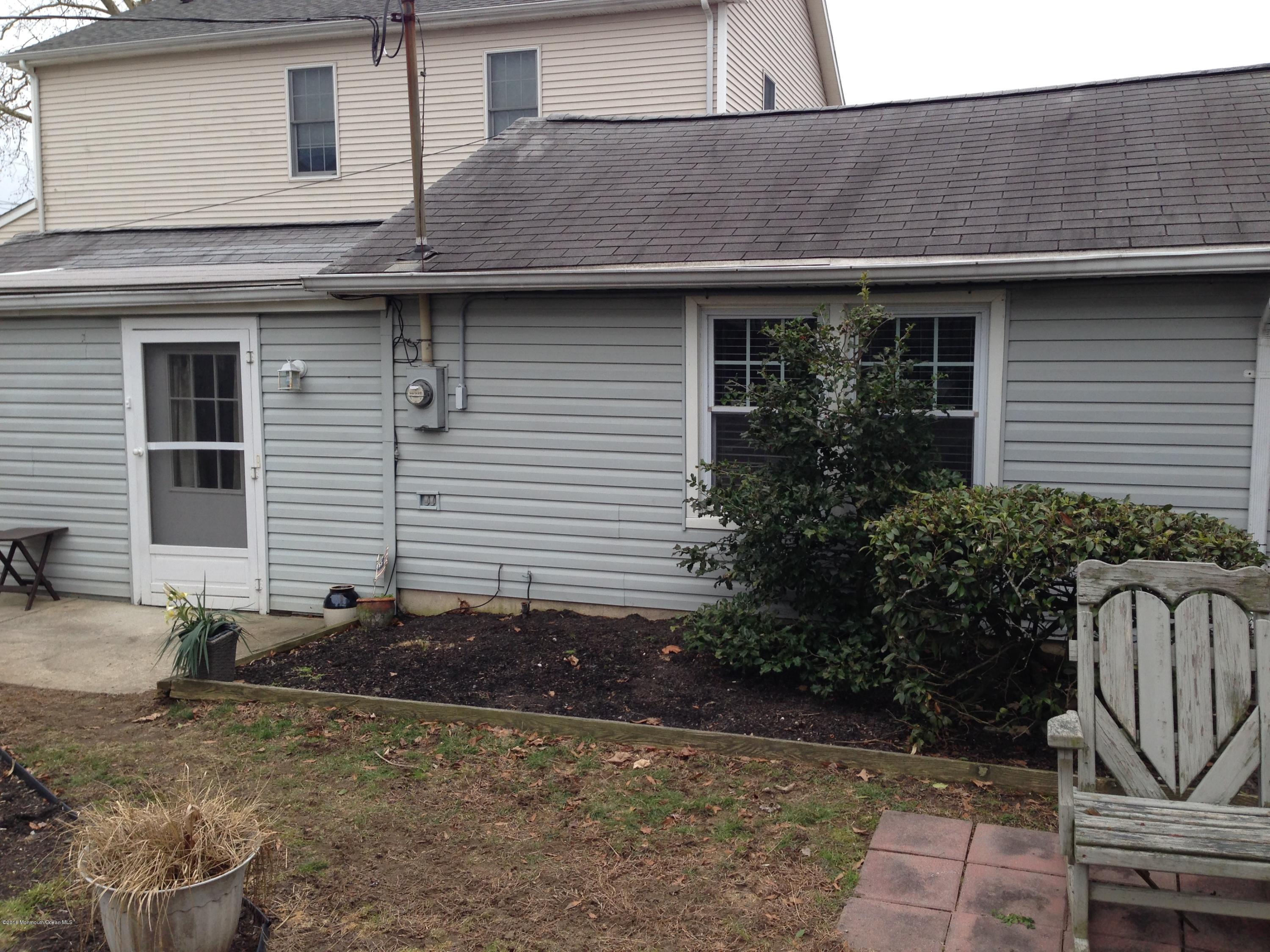115 10th Avenue Spring Lake Heights, NJ 07762 - Photo 10 of 15 a view of a house with a yard and plants
