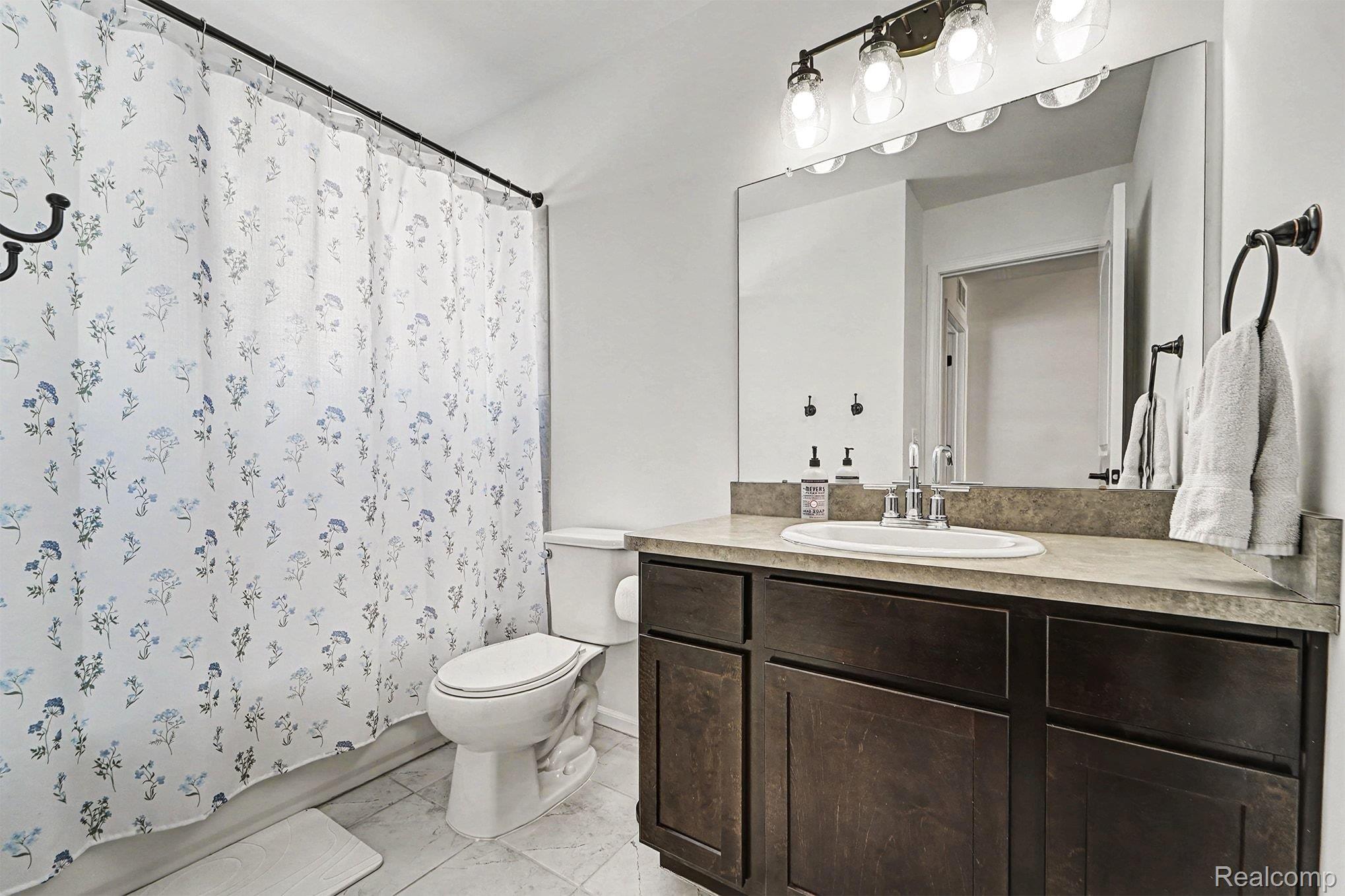 2471 Massoit Road Royal Oak, MI 48073 - Photo 32 of 49 Full bath with vanity and shower / bath combo with shower curtain