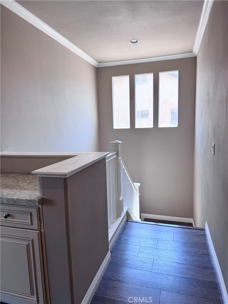 28463 Cascade Road Castaic, CA 91384 - Photo 10 of 29 a view of an empty room with wooden floor and a window