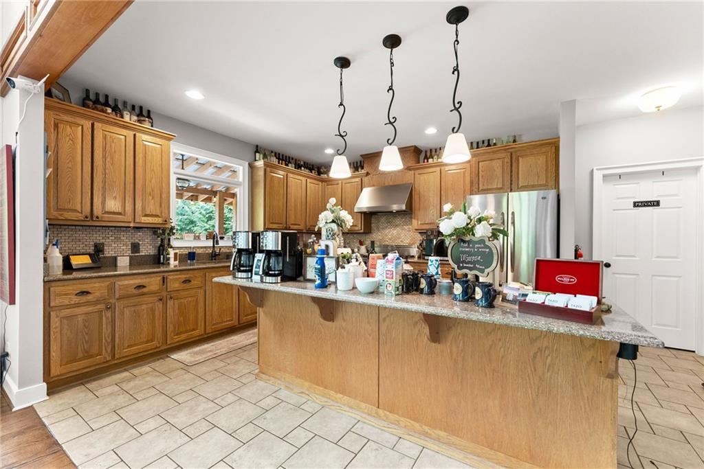253 Happy Trails Way Jasper, GA 30143 - Photo 66 of 97 a kitchen with sink cabinets and window