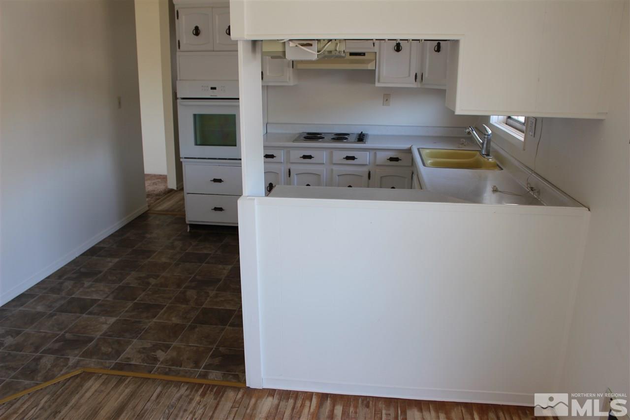 14580 Seminole Trail Reno, NV 89521 - Photo 3 of 21 a kitchen with stainless steel appliances a refrigerator and a stove