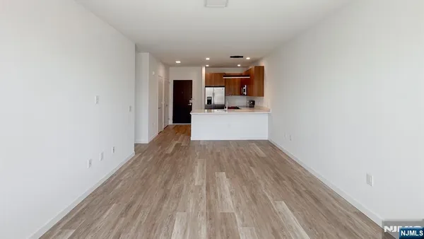 a view of a kitchen with wooden floor