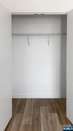 a view of a room with shelf on the wall