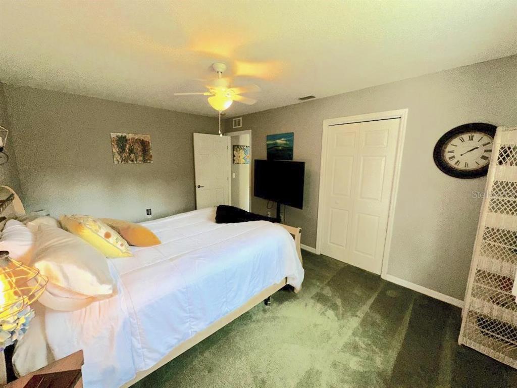 891 East Rembrandt Way Inverness, FL 34453 - Photo 22 of 27 a bedroom with a bed and a window
