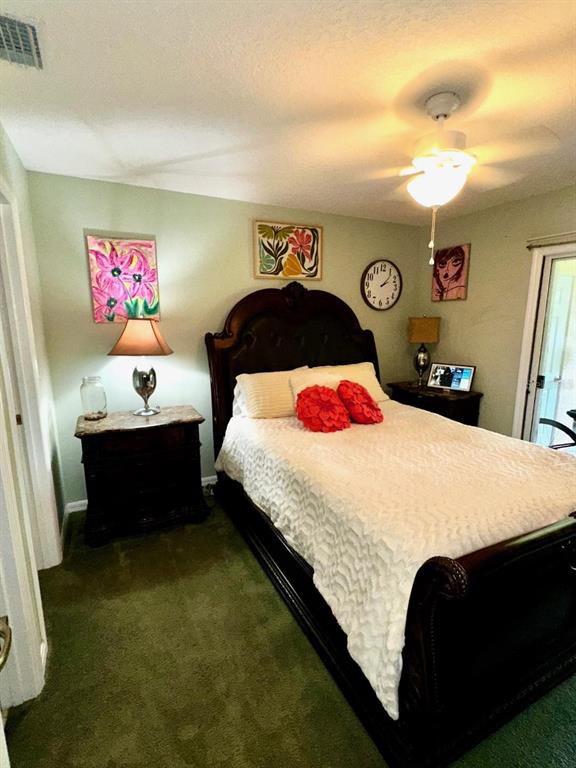 891 East Rembrandt Way Inverness, FL 34453 - Photo 25 of 27 a bedroom with a bed and a table in it