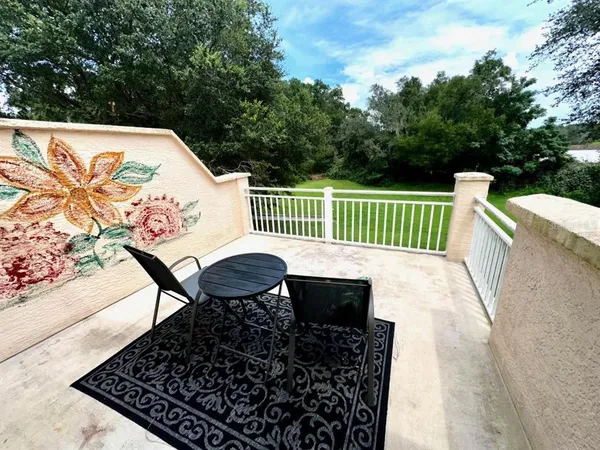 swimming pool view with a seating space