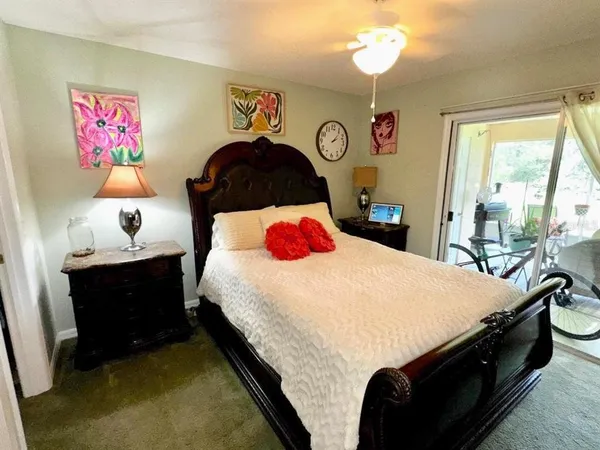 a bedroom with bed and a window