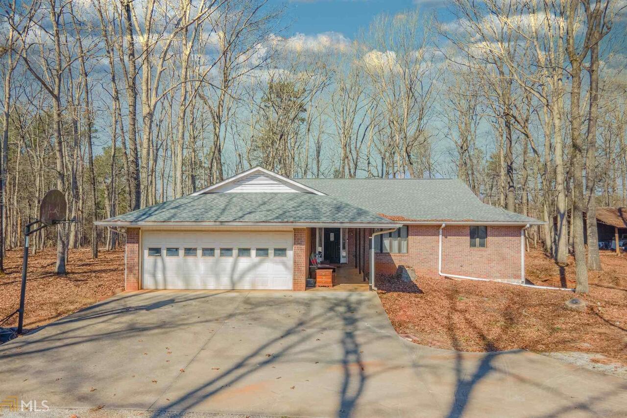 1976 Westbrook Road Commerce, GA 30530 - Photo 1 of 1 front view of a house with large trees