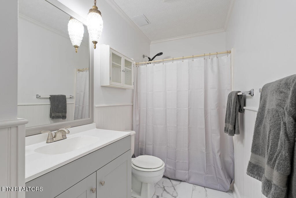 8908 Ellis Lane Powell, TN 37849 - Photo 14 of 37 a bathroom with a sink toilet and shower