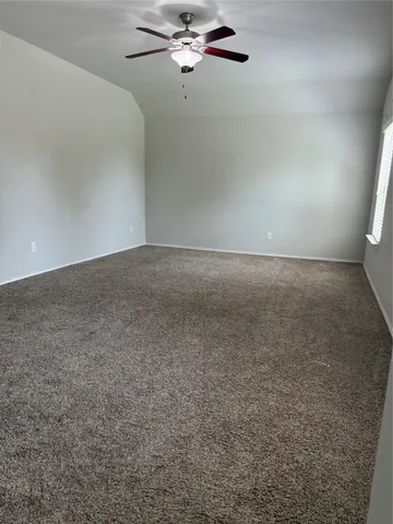 a view of a big room with carpet