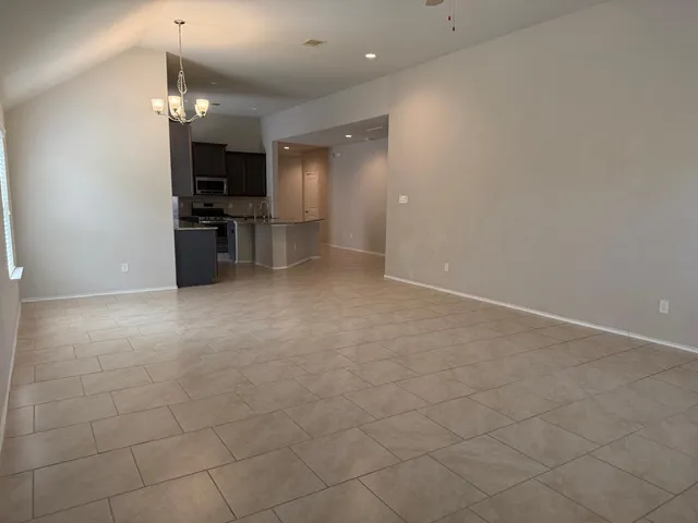 a kitchen with stainless steel appliances granite countertop a stove and a microwave