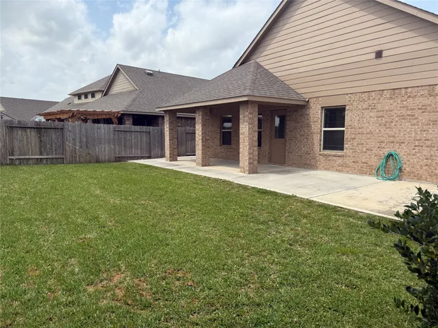 a view of a backyard of the house