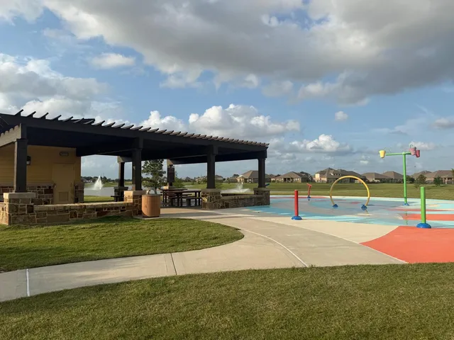 a view of a swimming pool with a yard