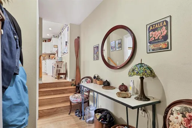 a bathroom with a sink mirror and vanity