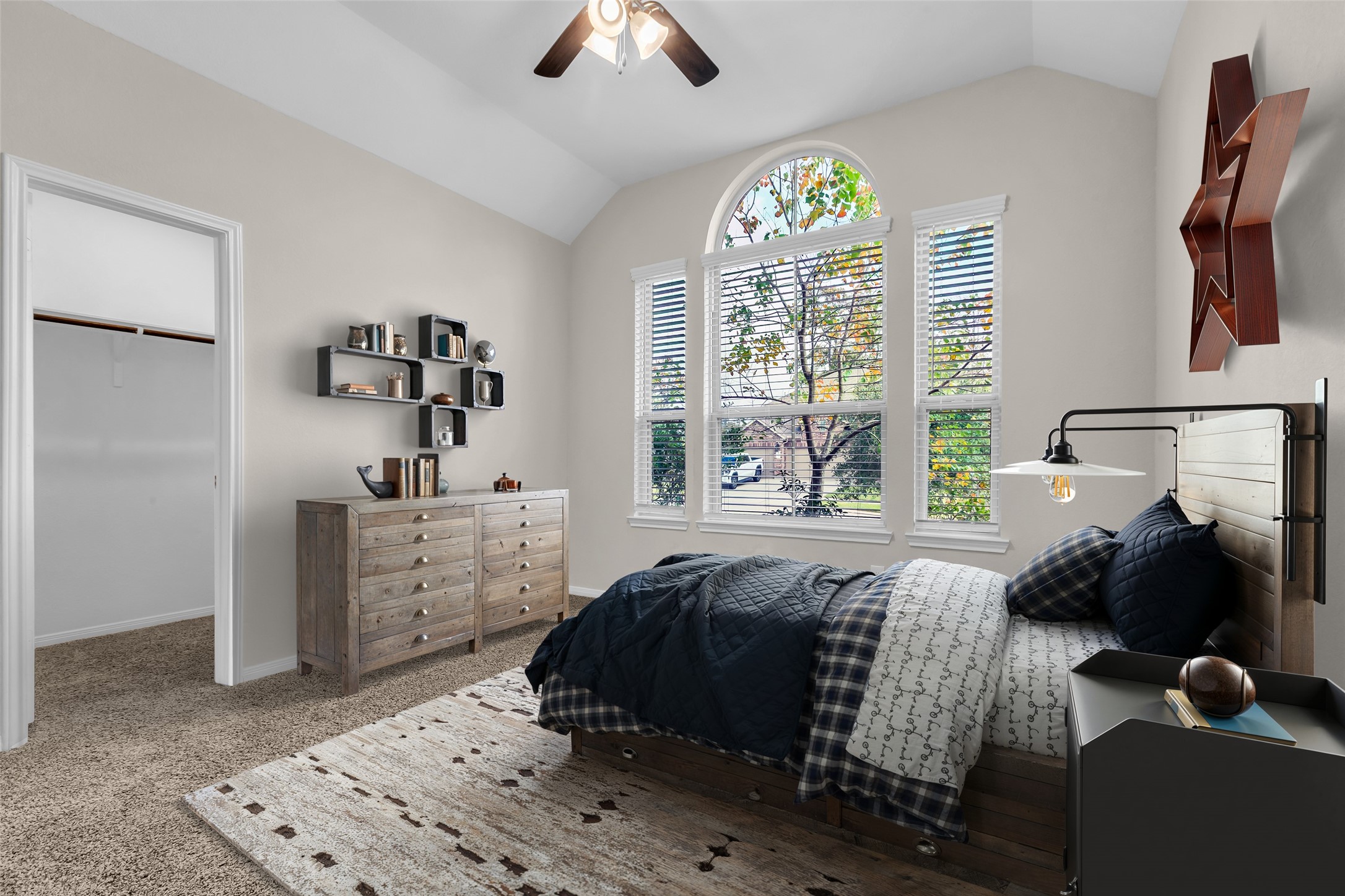 14304 Prospect Park Lane Conroe, TX 77384 - Photo 18 of 38 a bedroom with a bed and a window