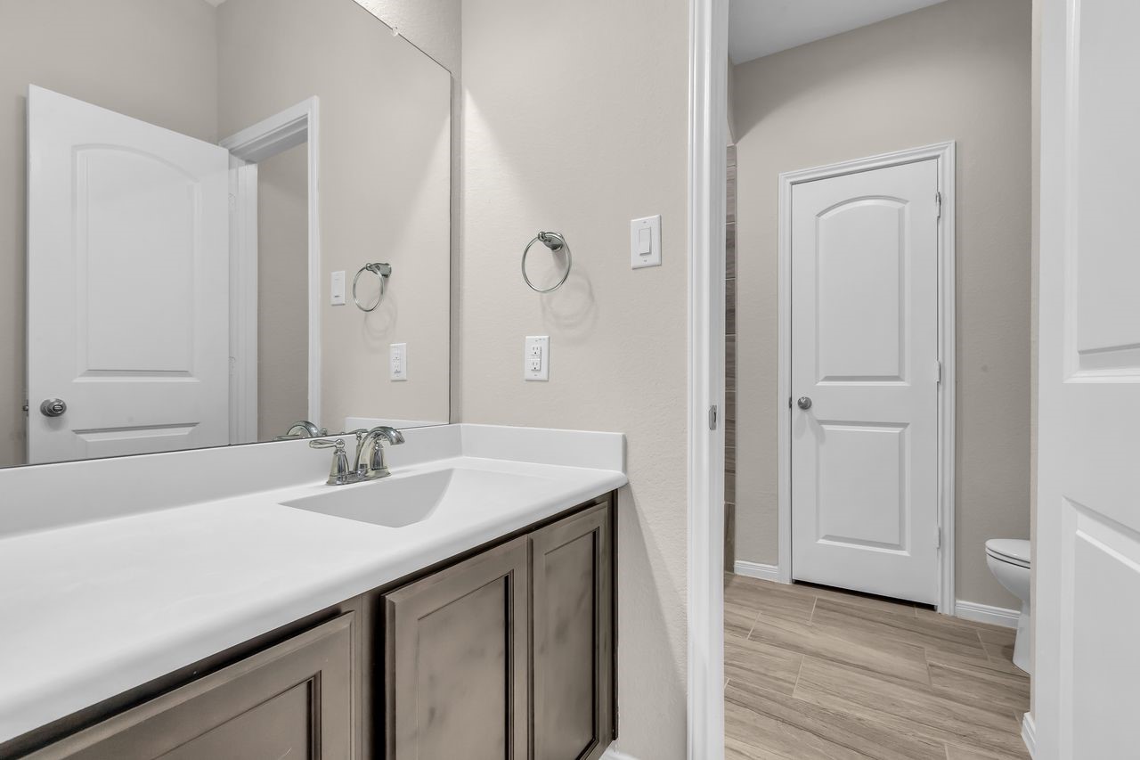 14304 Prospect Park Lane Conroe, TX 77384 - Photo 21 of 38 a bathroom with a sink and a mirror