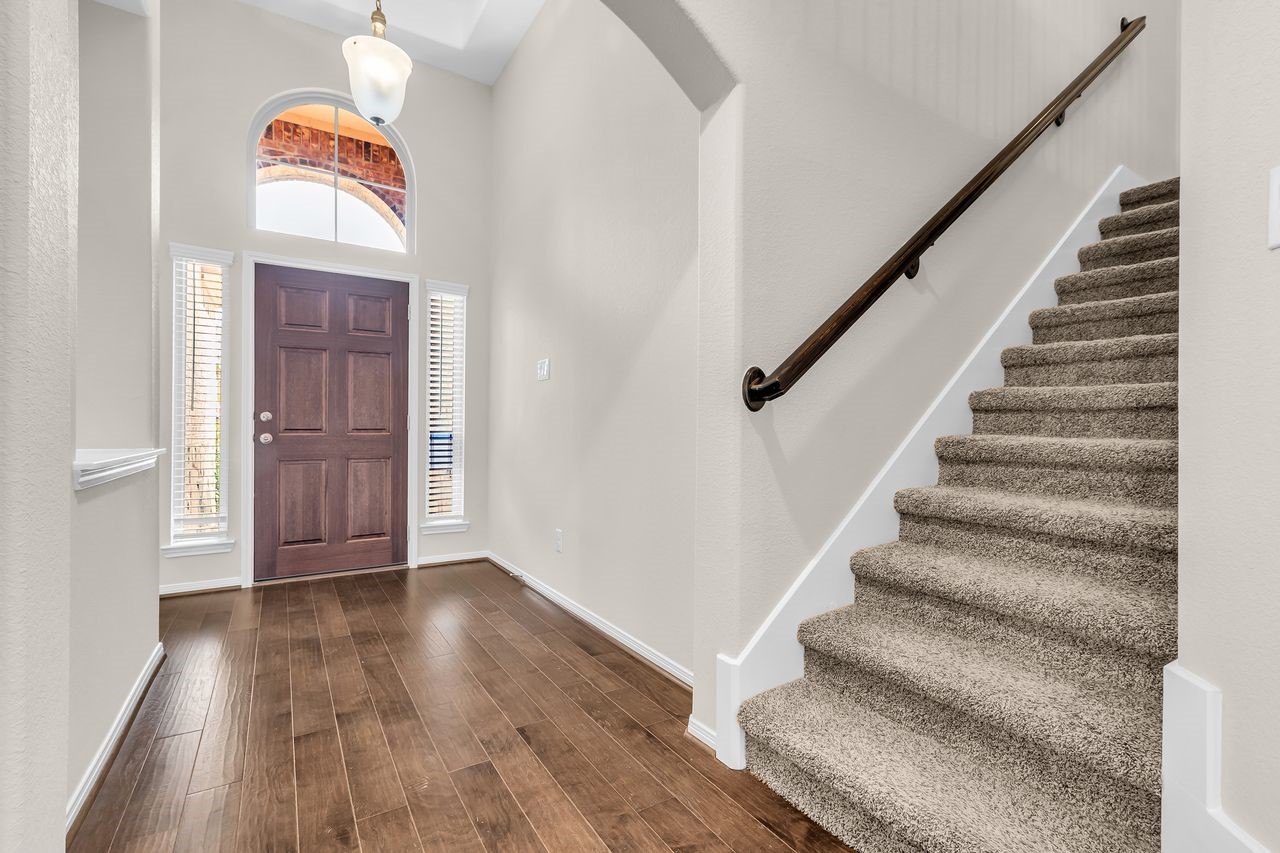 14304 Prospect Park Lane Conroe, TX 77384 - Photo 3 of 38 a view of an entryway with wooden floor