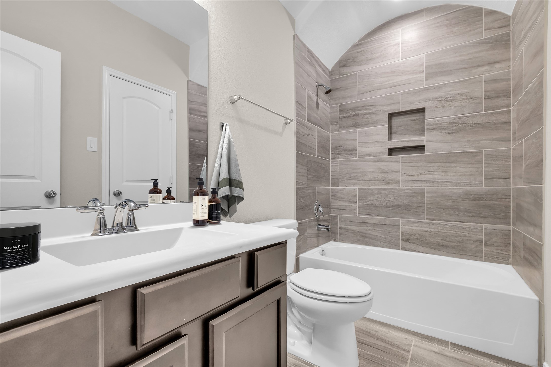 14304 Prospect Park Lane Conroe, TX 77384 - Photo 32 of 38 a bathroom with a sink a toilet and bathtub