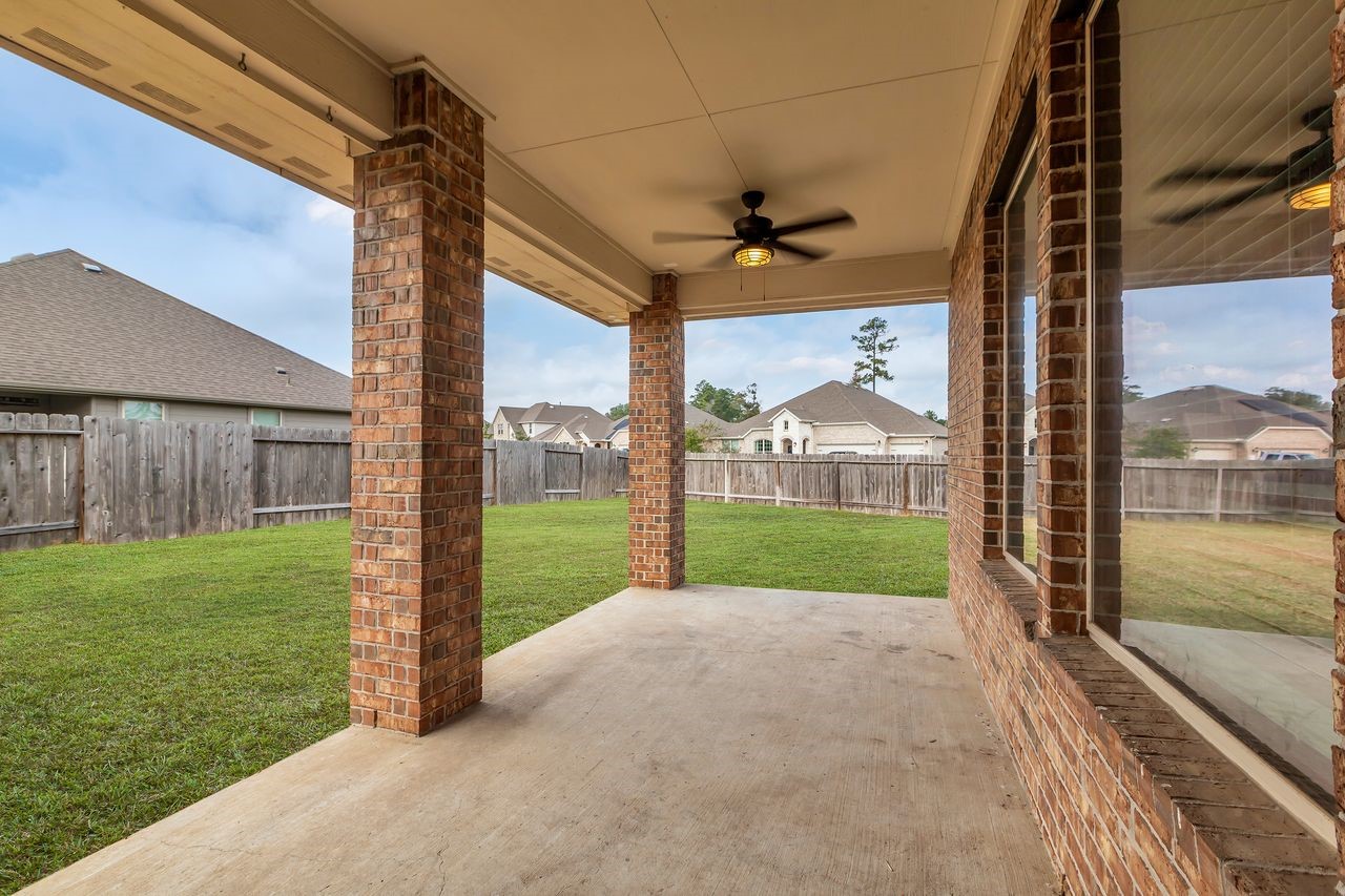 14304 Prospect Park Lane Conroe, TX 77384 - Photo 33 of 38 a view of a porch with a yard