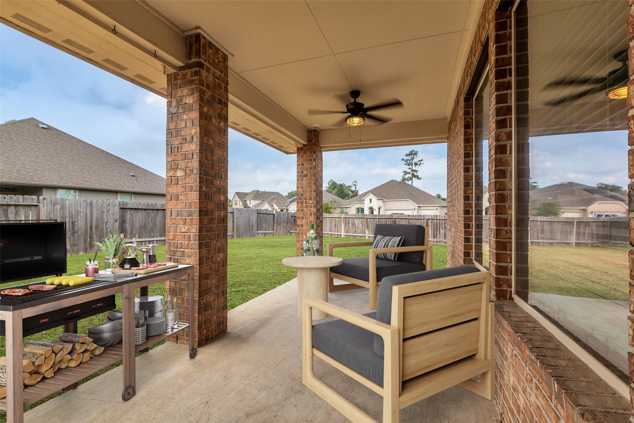 14304 Prospect Park Lane Conroe, TX 77384 - Photo 34 of 38 a view of living room with patio furniture and a floor to ceiling window